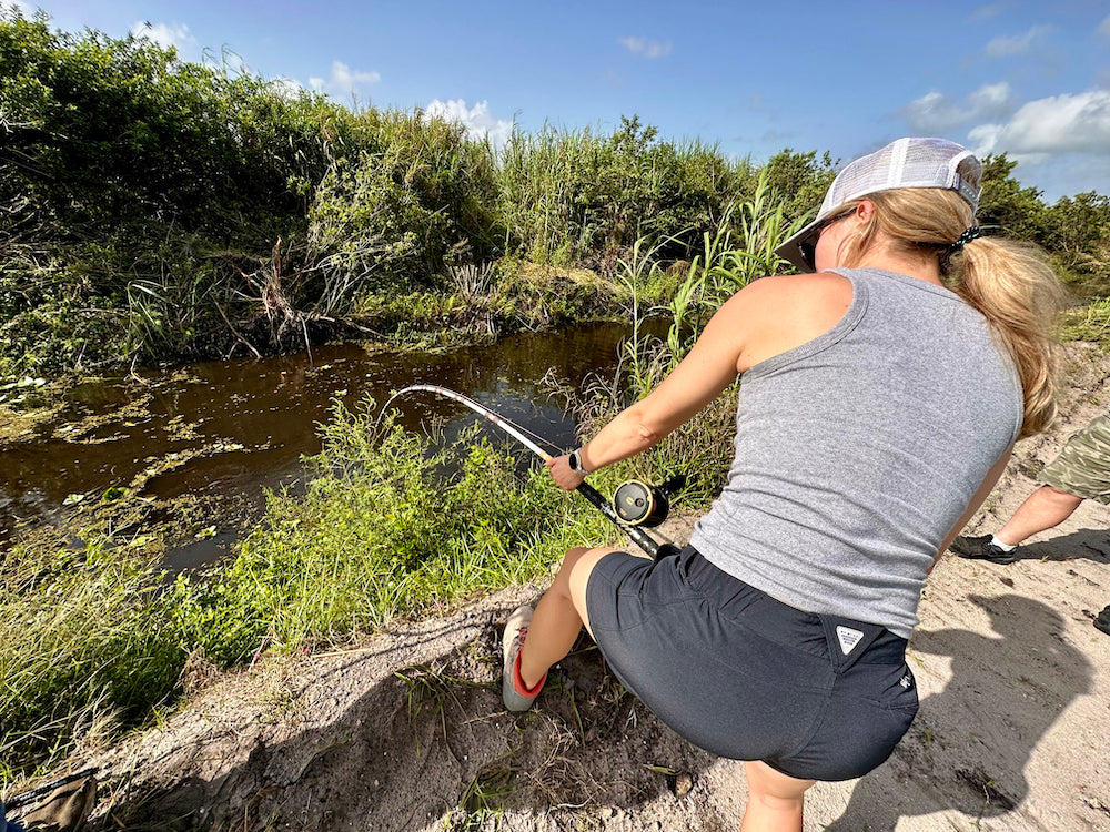 Woman fighting alligator on rod and reel! 